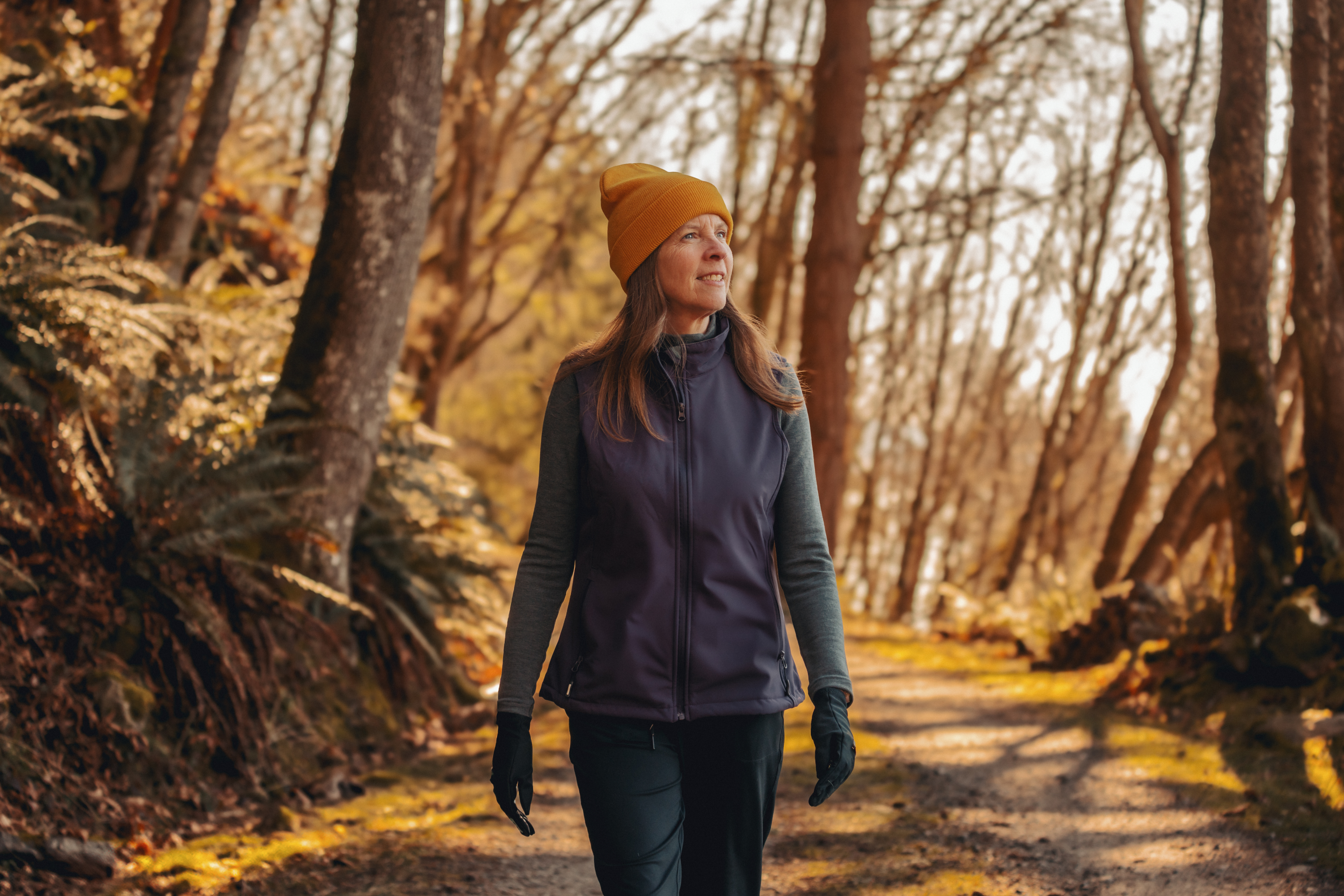Genevie, living with FCS and a paid speaker for Ionis Image showing FCS patient and paid speaker for Ionis, Genevie, walking on a path outside